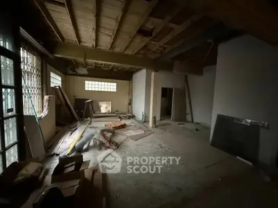 Spacious unfinished room with potential for renovation in prime location.
