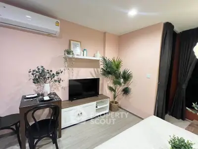 Charming living room with modern decor and cozy dining area, perfect for relaxation and entertainment.