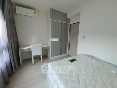 Modern bedroom with air conditioning and stylish furniture in a bright apartment.