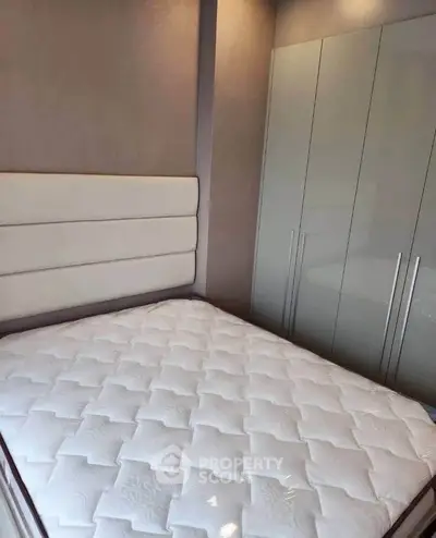 Modern bedroom with stylish wardrobe and comfortable bed in a cozy apartment.