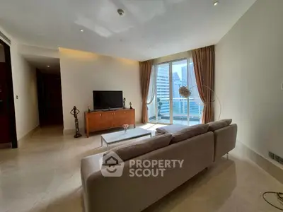 Spacious living room with modern decor and city view balcony in luxury apartment.