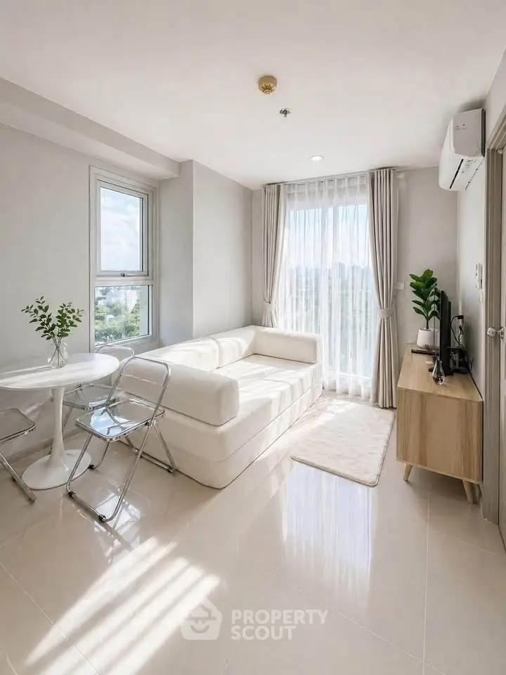 Bright modern living room with large windows and stylish furniture in a high-rise apartment.
