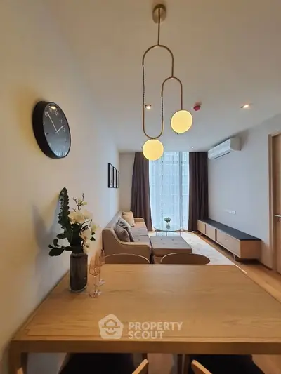 Modern living room with stylish lighting and cozy seating area.