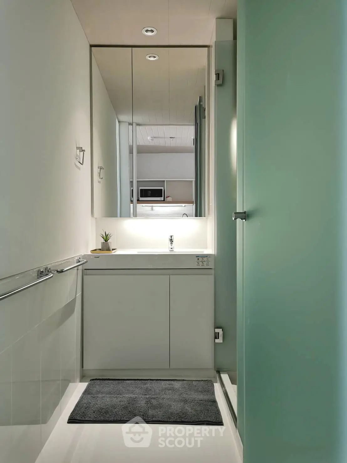 Modern minimalist bathroom with sleek design and large mirror