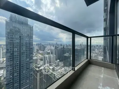 Stunning high-rise balcony with panoramic city skyline views, perfect for urban living enthusiasts.