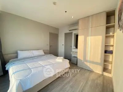 Bright and cozy bedroom with modern furnishings and ample natural light