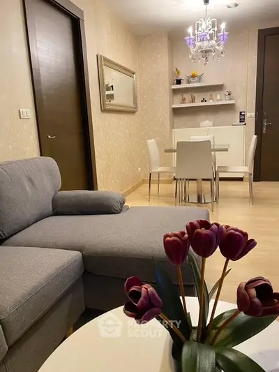 Stylish living room with modern decor and elegant dining area, perfect for cozy gatherings.