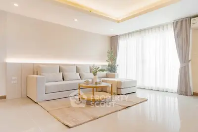 Spacious modern living room with elegant decor and natural light