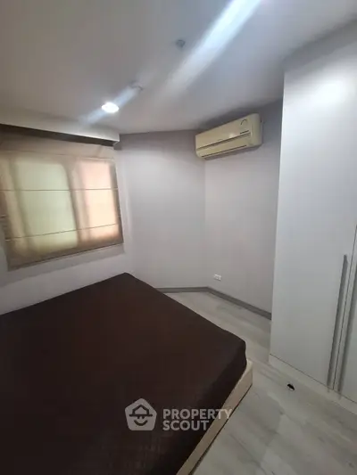 Cozy bedroom with air conditioning and modern decor in a stylish apartment.