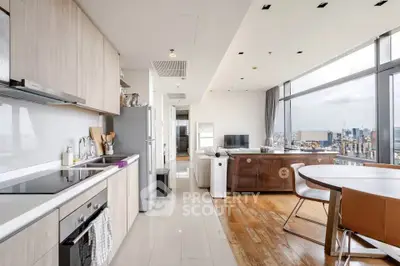 Modern open-layout kitchen and living room with city view in luxury apartment