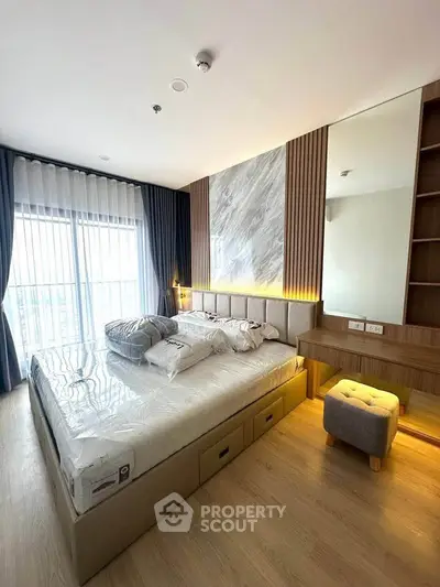 Luxurious modern bedroom with stylish decor and large window view