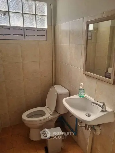 Cozy bathroom with modern fixtures and natural light, perfect for a comfortable living space.