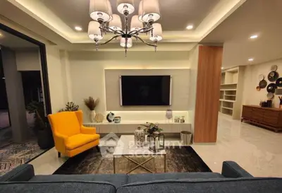 Luxurious modern living room with elegant chandelier and stylish decor