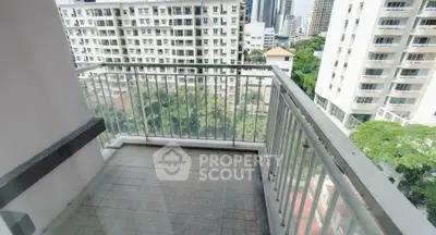 Spacious balcony with city view in modern high-rise apartment