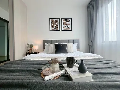 Modern bedroom with stylish decor and cozy ambiance, featuring a comfortable bed and elegant furnishings.