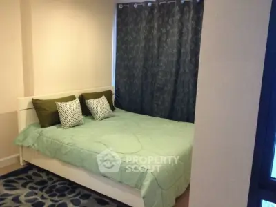 Cozy bedroom with stylish decor and comfortable bedding in modern apartment.
