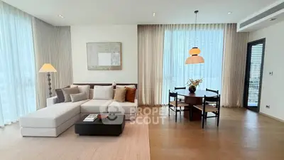 Spacious modern living room with elegant decor and large windows