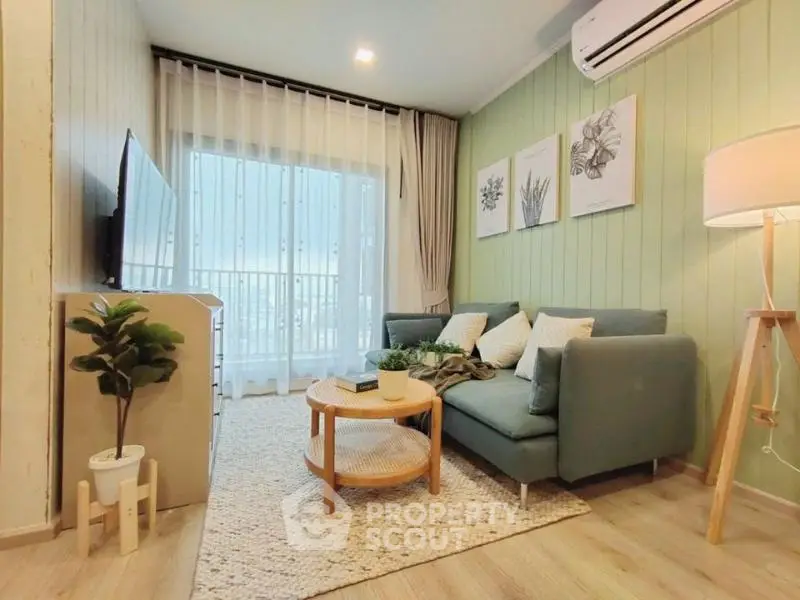 Charming living room with cozy sofa, stylish decor, and natural light from large window.