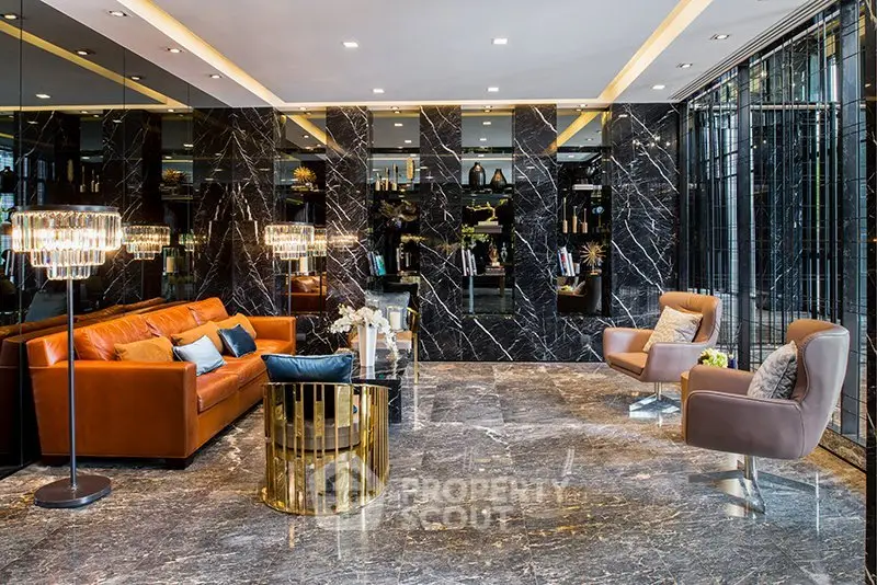 Luxurious modern living room with marble walls and floor, elegant leather seating, and stylish lighting.