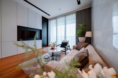 Luxurious modern living room with elegant decor and floor-to-ceiling windows.