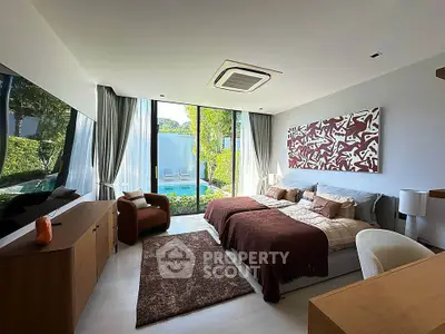 Luxurious bedroom with modern decor and large window overlooking a lush garden, perfect for relaxation.
