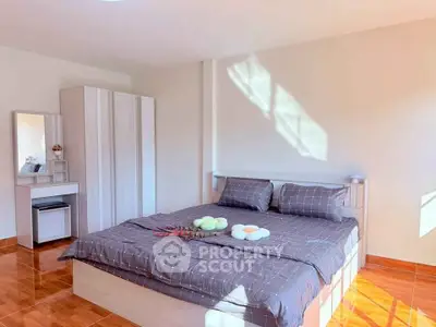 Bright and cozy bedroom with modern furnishings and natural light