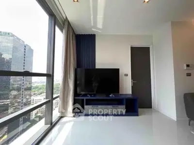 Modern living room with large windows offering stunning city views and sleek interior design.