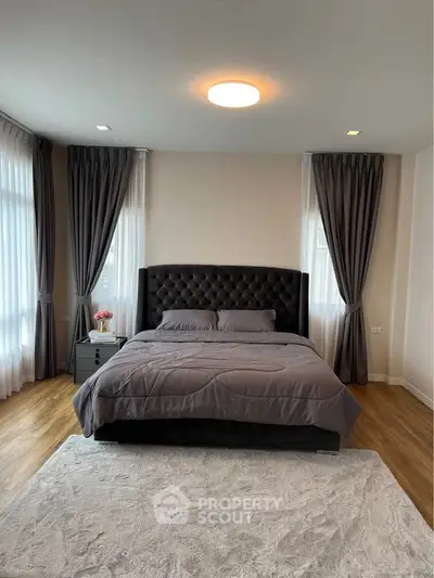 Luxurious bedroom with elegant decor and plush bedding