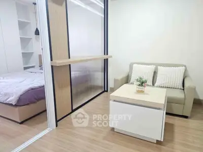 Modern studio apartment with cozy living area and sliding partition