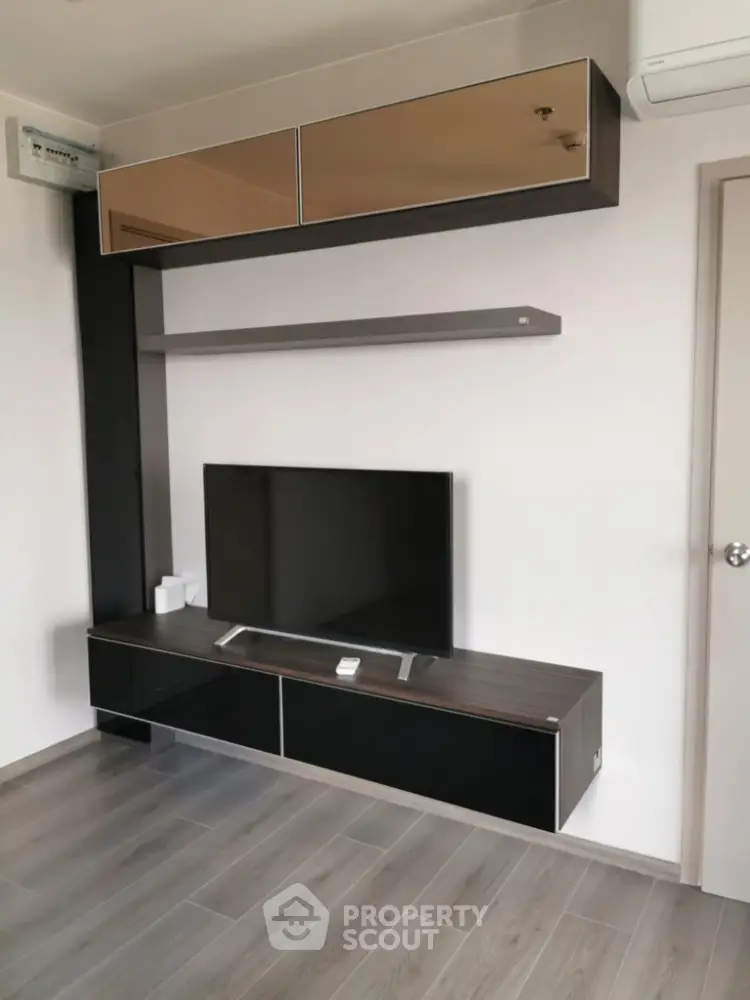 Modern living room with sleek TV unit and stylish shelving
