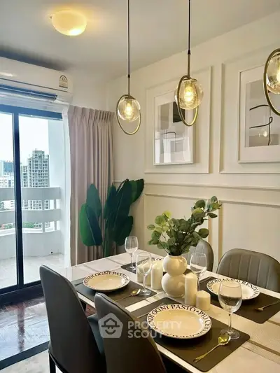 Elegant dining area with modern decor and city view from balcony, perfect for urban living.