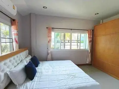Bright and airy bedroom with large window and modern decor