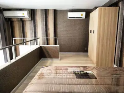 Modern bedroom with air conditioning and stylish decor in a contemporary apartment.