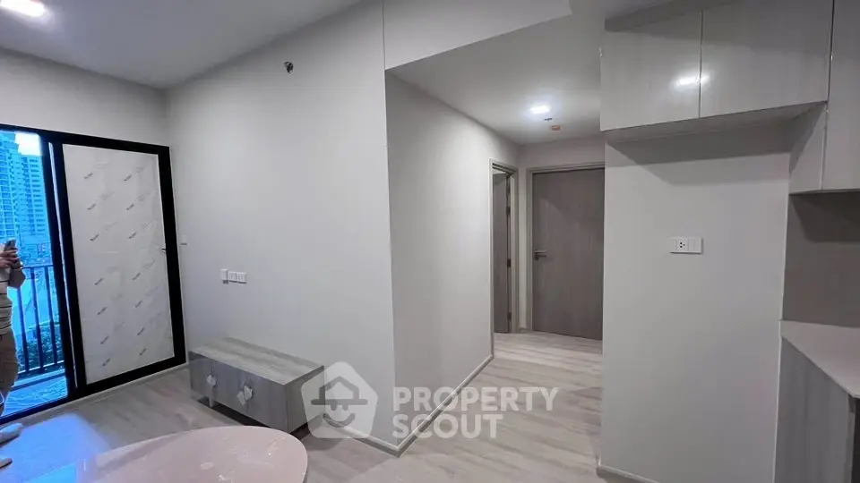 Modern apartment interior with sleek design and balcony view