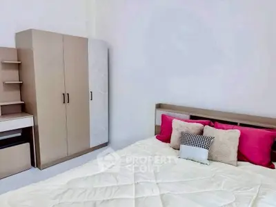 Modern bedroom with stylish wardrobe and cozy bed setup