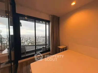 Spacious bedroom with stunning city view and large balcony access