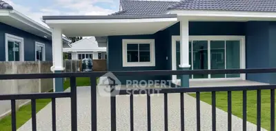 Modern single-story home with sleek design and spacious driveway, perfect for family living.