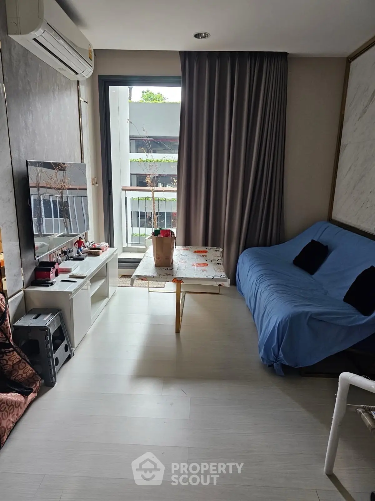 Cozy living room with modern decor and balcony view