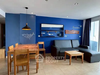 Stylish living room with blue accent wall and modern furniture