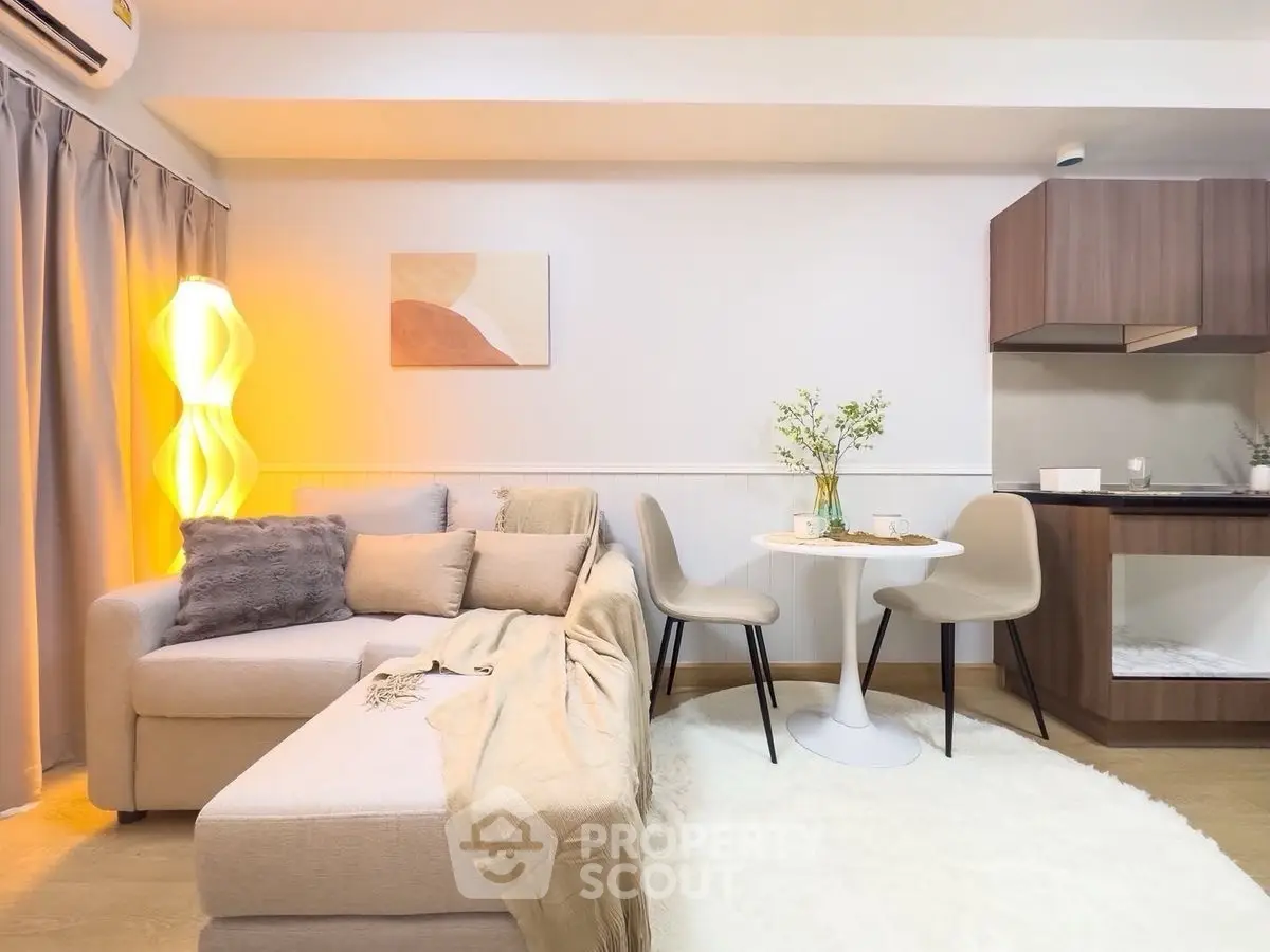 Stylish modern living room with cozy sofa and elegant dining area