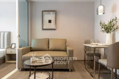 Modern living room with sleek furniture and elegant decor in a stylish apartment.