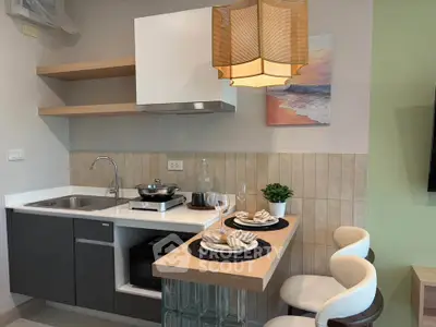 Modern compact kitchen with stylish decor and breakfast bar in cozy apartment