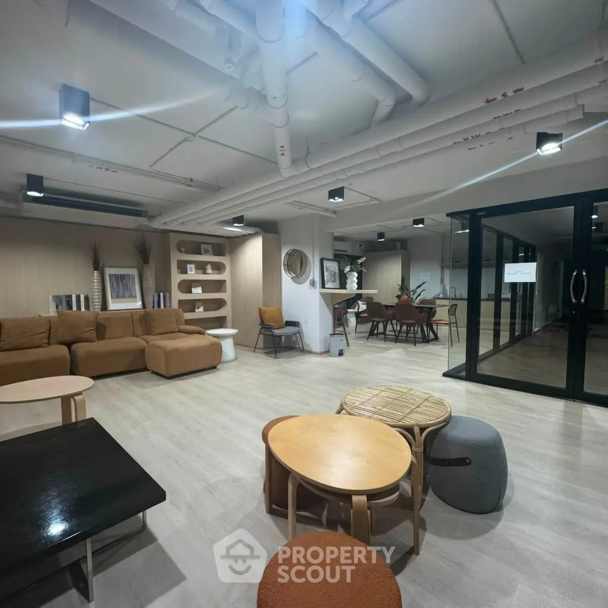Modern co-working space with stylish furniture and open layout for collaborative work.