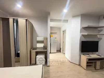 Modern studio apartment with sleek furniture and open layout