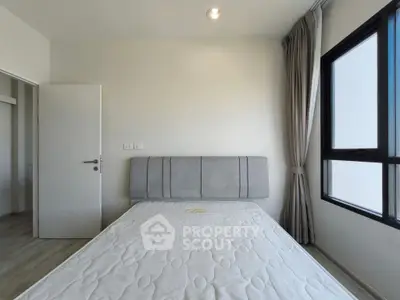 Modern minimalist bedroom with natural light and stylish decor