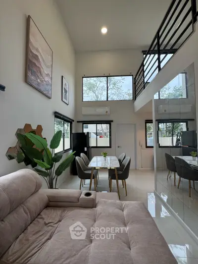 Modern living room with high ceiling and stylish decor in a contemporary home