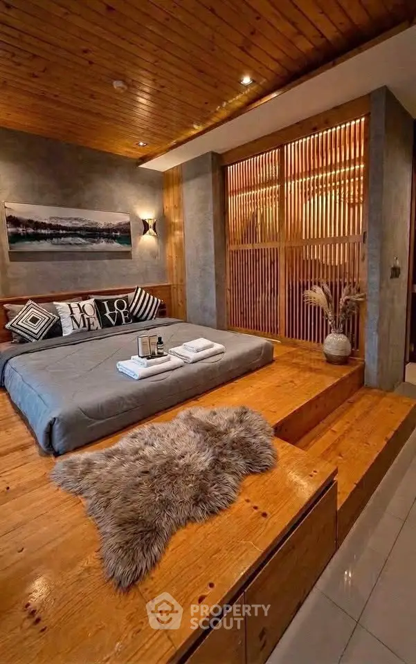 Luxurious bedroom with wooden accents and cozy decor