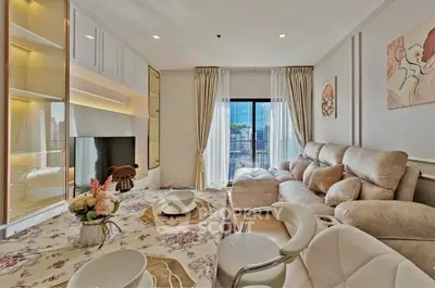 Luxurious living room with elegant decor and large windows offering a stunning view.