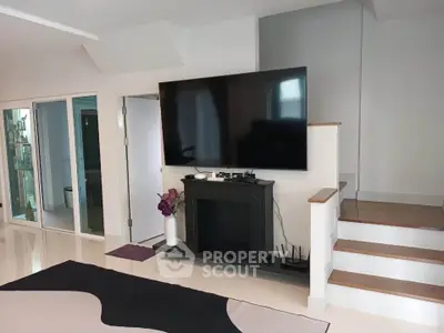 Modern living room with sleek TV setup and stylish decor