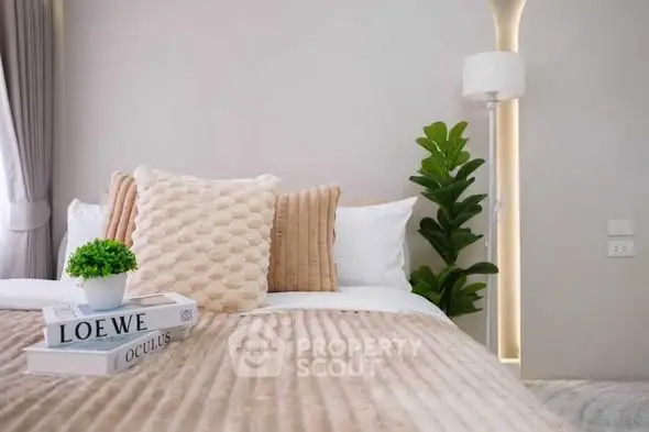 Luxurious bedroom with plush bedding and stylish decor, perfect for relaxation and comfort.